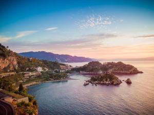 an island in the middle of a body of water at Taormina Panoramic Hotel in Taormina