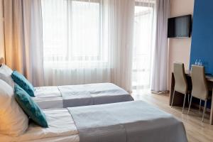 Postel nebo postele na pokoji v ubytování Janda Resort & Conference