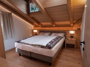 Posteľ alebo postele v izbe v ubytovaní Stella Alpina Suite