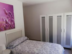 Łóżko lub łóżka w pokoju w obiekcie Casa Carminuca