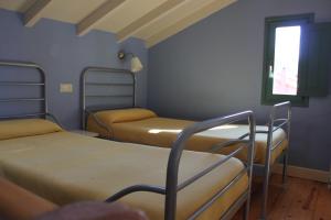 Postel nebo postele na pokoji v ubytování Apartamentos del Norte