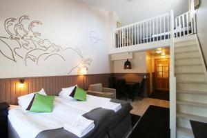 Postel nebo postele na pokoji v ubytování Hotel Hullu Poro