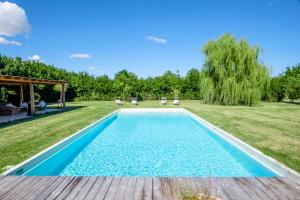 The swimming pool at or close to the green home