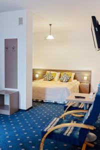 Voodi või voodid majutusasutuse Janda Resort & Conference toas
