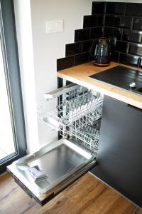 Kuchyň nebo kuchyňský kout v ubytování Apartament Gardenia No.1