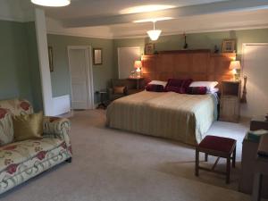 Katil atau katil-katil dalam bilik di Cliff Farmhouse B&B Suites