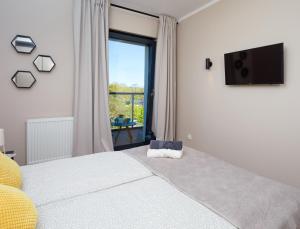 Postel nebo postele na pokoji v ubytování Apartament Gardenia No.1
