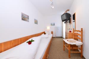 Posteľ alebo postele v izbe v ubytovaní Familienhotel Kleinwalsertal