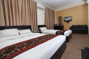 Postelja oz. postelje v sobi nastanitve Hotel Hema