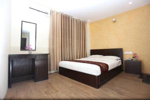 Postelja oz. postelje v sobi nastanitve Hotel Hema