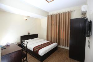 Postelja oz. postelje v sobi nastanitve Hotel Hema