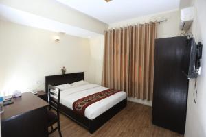 Postelja oz. postelje v sobi nastanitve Hotel Hema