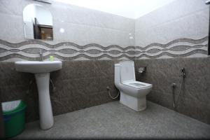 Kopalnica v nastanitvi Hotel Hema