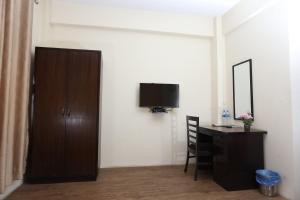 TV in/ali zabaviščno središče v nastanitvi Hotel Hema