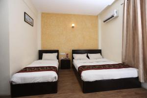 Postelja oz. postelje v sobi nastanitve Hotel Hema