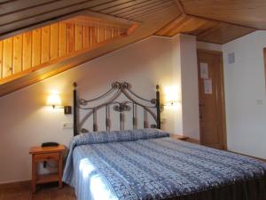 En eller flere senger på et rom på Hotel Las Nieves