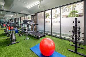 a gym with exercise equipment and a large red ball at Grand Sunrise Boutique Hotel in Da Nang