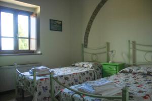 Voodi või voodid majutusasutuse Colle Bertini toas