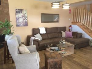 a living room with a couch and a table at La Llastra de Garaña in Llanes