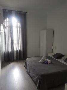 Posteľ alebo postele v izbe v ubytovaní Hostal Martinval