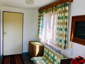 A bed or beds in a room at Rodinný RETRO domček