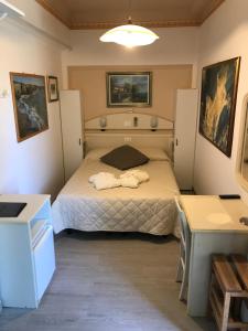 Postel nebo postele na pokoji v ubytování Hotel Byron