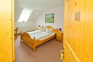 Postel nebo postele na pokoji v ubytování Hotel Garni Am Klostermarkt