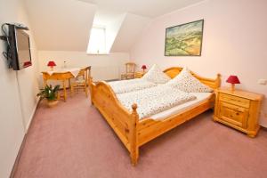 Postel nebo postele na pokoji v ubytování Hotel Garni Am Klostermarkt
