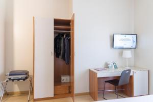 a room with a desk and a chair at B&B Hotel Pescara in Pescara
