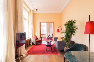 a living room with a couch and a table at Orania.Berlin in Berlin