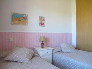 A bed or beds in a room at El Eresma de Carmen
