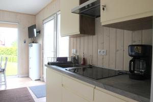 Kuchyňa alebo kuchynka v ubytovaní Apartamenty pod Wilczakiem