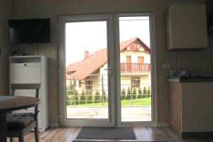 Kuchyňa alebo kuchynka v ubytovaní Apartamenty pod Wilczakiem