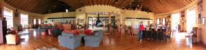 a lobby with couches and chairs in a building at Rorke's Drift Hotel in Rorkeʼs Drift