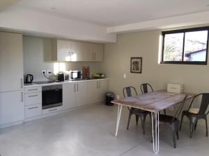 A kitchen or kitchenette at Klein Windhoek Garden flat