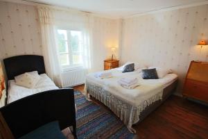 Postel nebo postele na pokoji v ubytování Elves Village Hotel