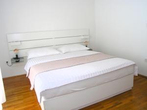 Posteľ alebo postele v izbe v ubytovaní Apartments Ines