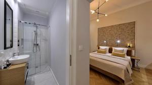 Łóżko lub łóżka w pokoju w obiekcie Bentis Luxury Apartments