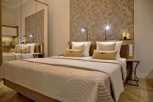 Łóżko lub łóżka w pokoju w obiekcie Bentis Luxury Apartments