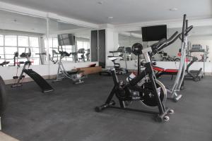 a gym with several exercise bikes in a room at Nouakchott Hotel in Nouakchott