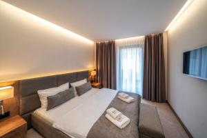 Posteľ alebo postele v izbe v ubytovaní Meta Apartments + 37 fotografií