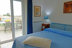 Ένα ή περισσότερα κρεβάτια σε δωμάτιο στο La Ninfa Di Capri