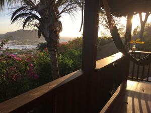 a view of the ocean from a balcony of a house at Italian Guesthouse in Gros Islet