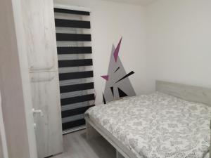 Llit o llits en una habitació de Apartment Triangle