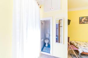 Postel nebo postele na pokoji v ubytování Rooms Katja & Lara