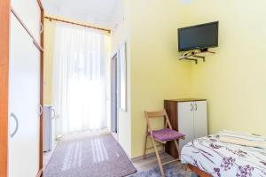 Postel nebo postele na pokoji v ubytování Rooms Katja & Lara