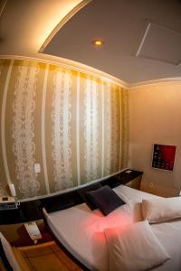 Cama o camas de una habitación en Motel Paradiso - Passo Fundo