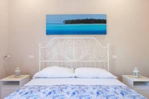 Postel nebo postele na pokoji v ubytování B&B Miccio
