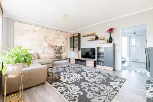 a living room with a couch and a fireplace at Private House in Hannover