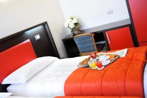 Postel nebo postele na pokoji v ubytování Hotel al Corso